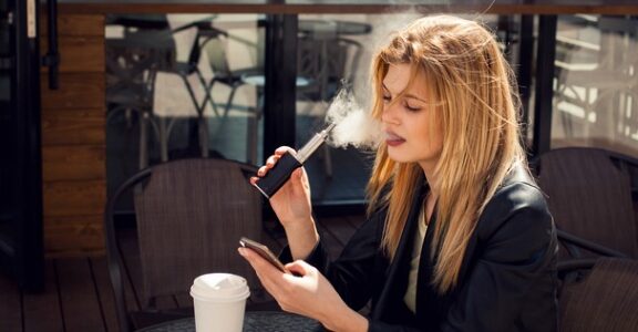 Woman at vaping cafe