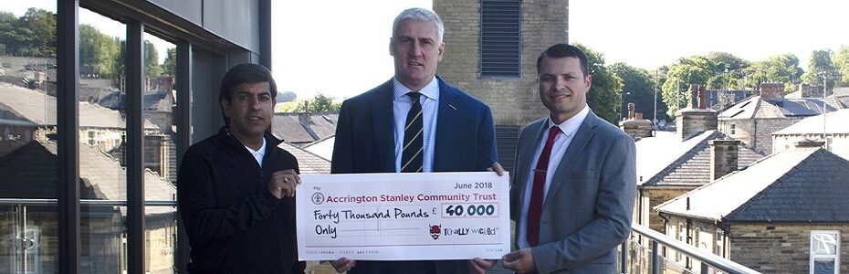 Fraser Cropper holding cheque
