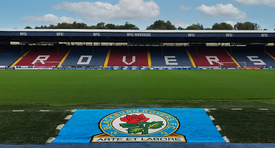 Blackburn Rovers' Pitch with stadium seating in the background.