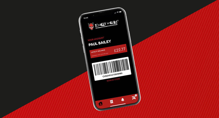 Blak and red background with a smart phone with the Totally Wicked Store App on the screen